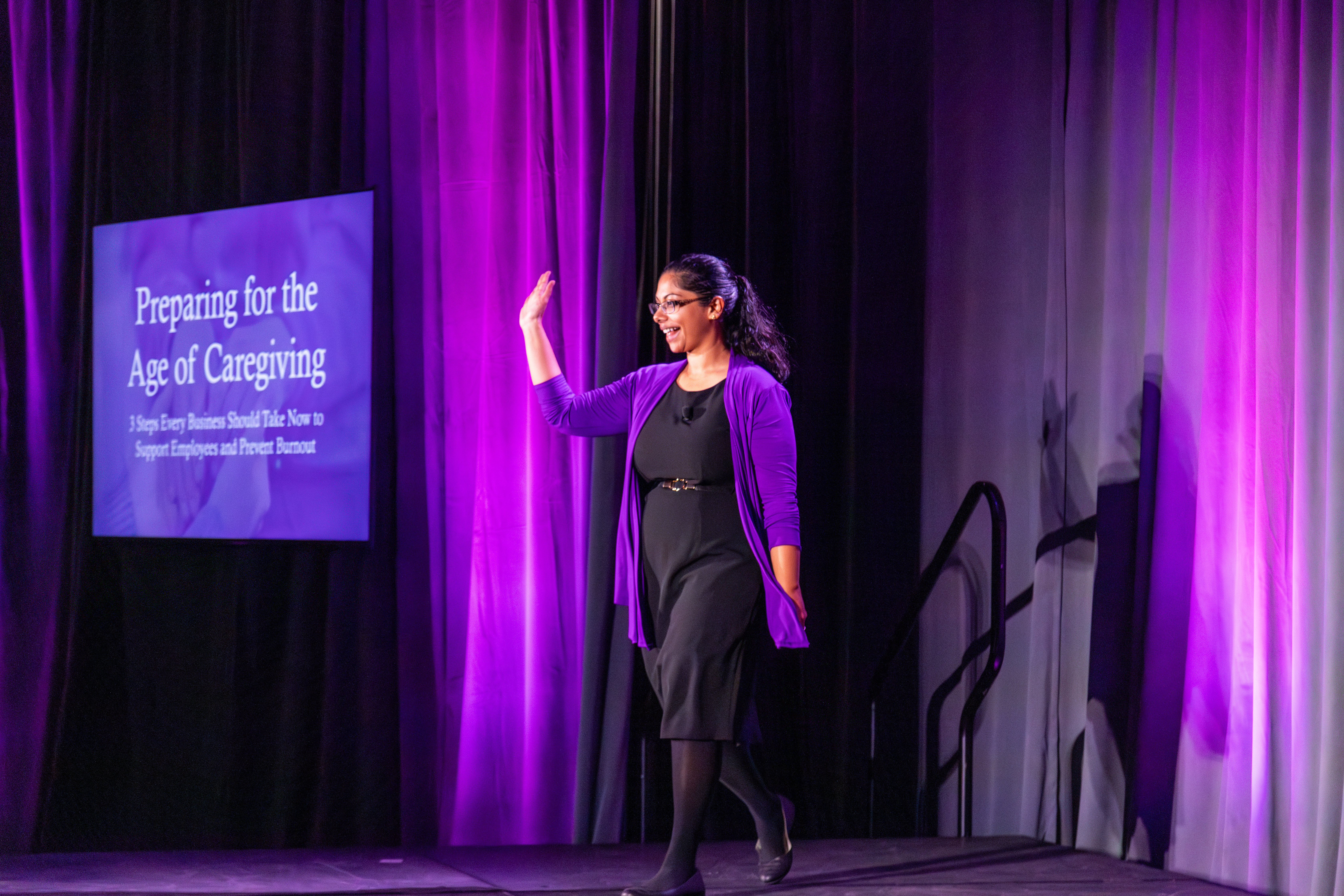 Dr. Anna Thomas speaking to corporate leaders about the Age of Caregiving