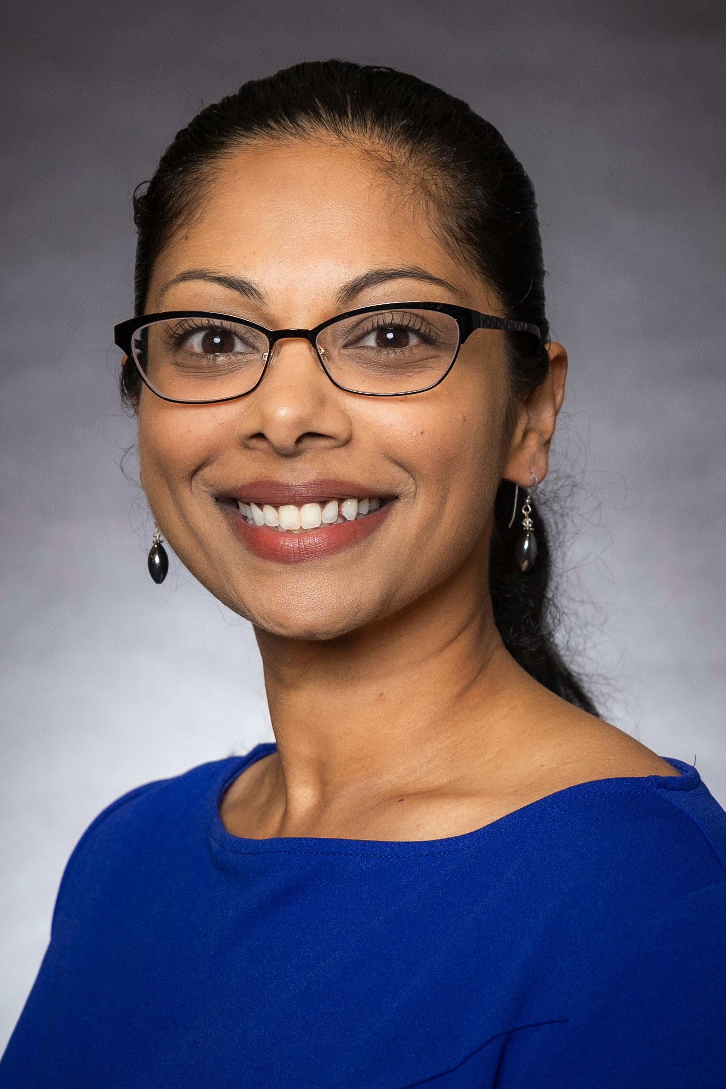 Dr. Anna Thomas, physician and leadership speaker, professional headshot