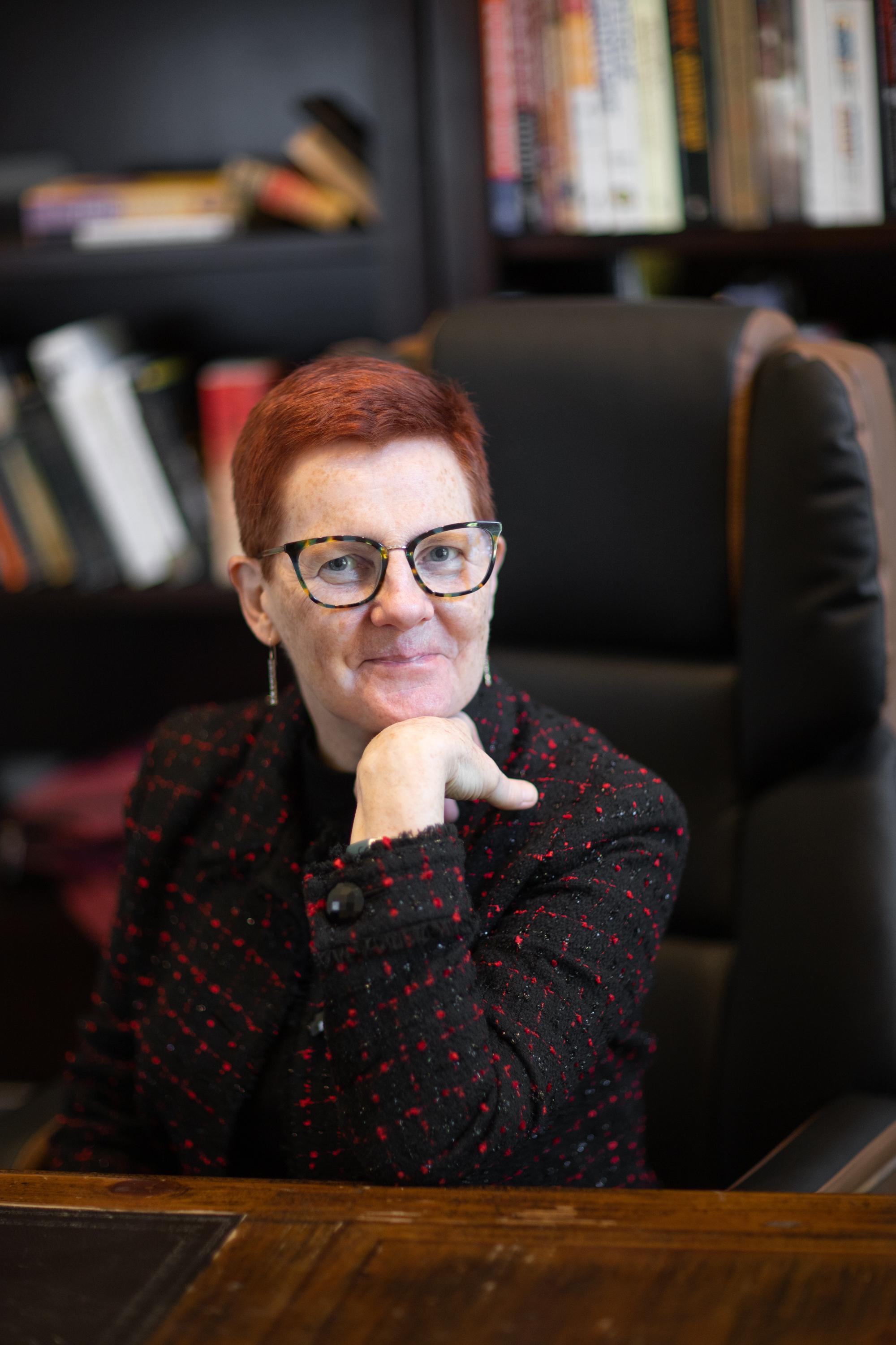 Ruth Pearce at her desk